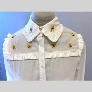 Poly crepe button up blouse with embroidered bee ruffled yoke and collar
